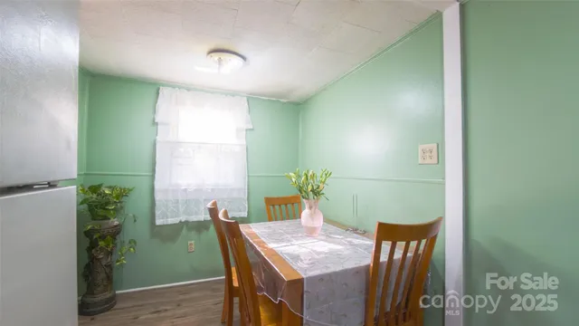 a view of hallway with wooden floor