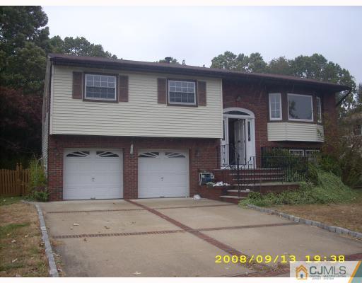 15 Gramercy Road Old Bridge, NJ 08857 - Photo 1 of 1 a front view of a house with a garden