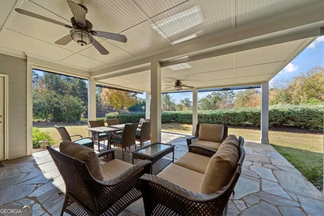 a view of room with a ceiling fan and window