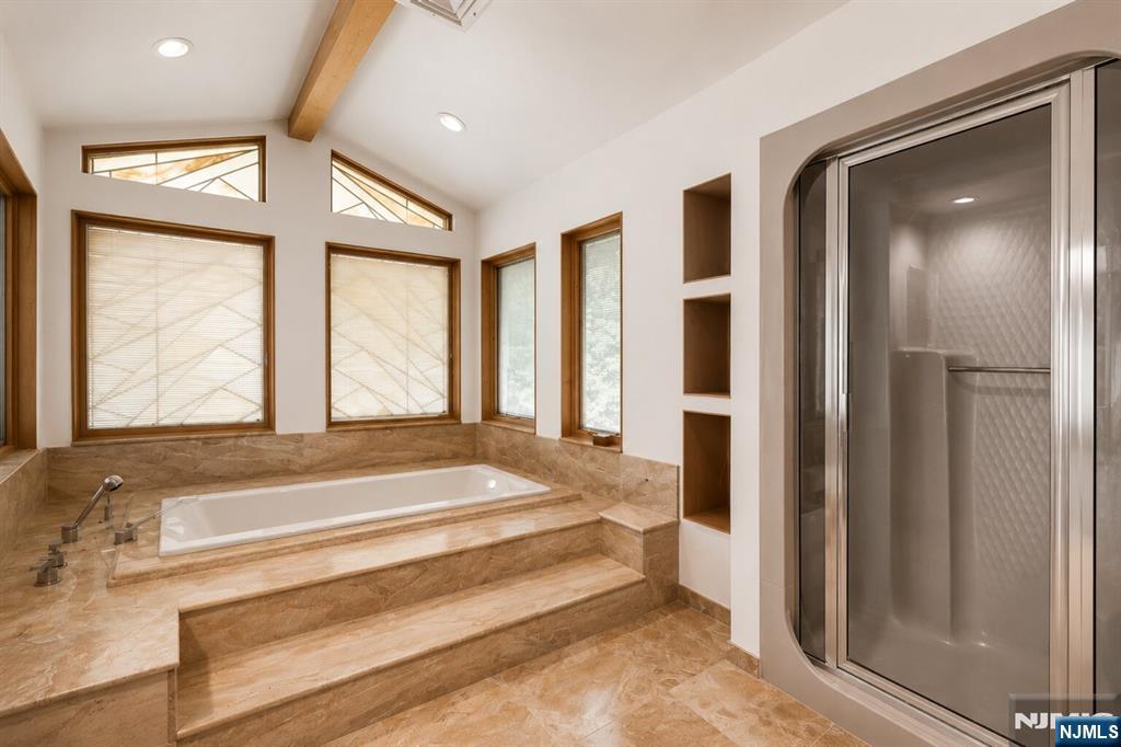 34 Cambridge Way Alpine, NJ 07620 - Photo 28 of 48 a spacious bedroom with a bed and large window