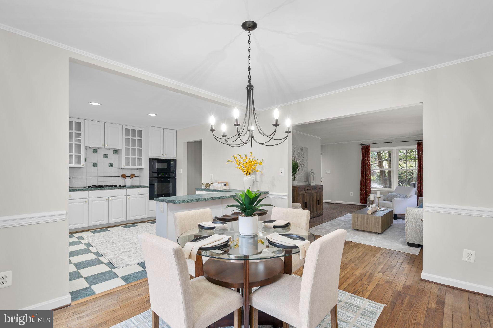 2126 Golf Course Drive Reston, VA 20191 - Photo 11 of 48 a view of a dining room with furniture wooden floor and chandelier