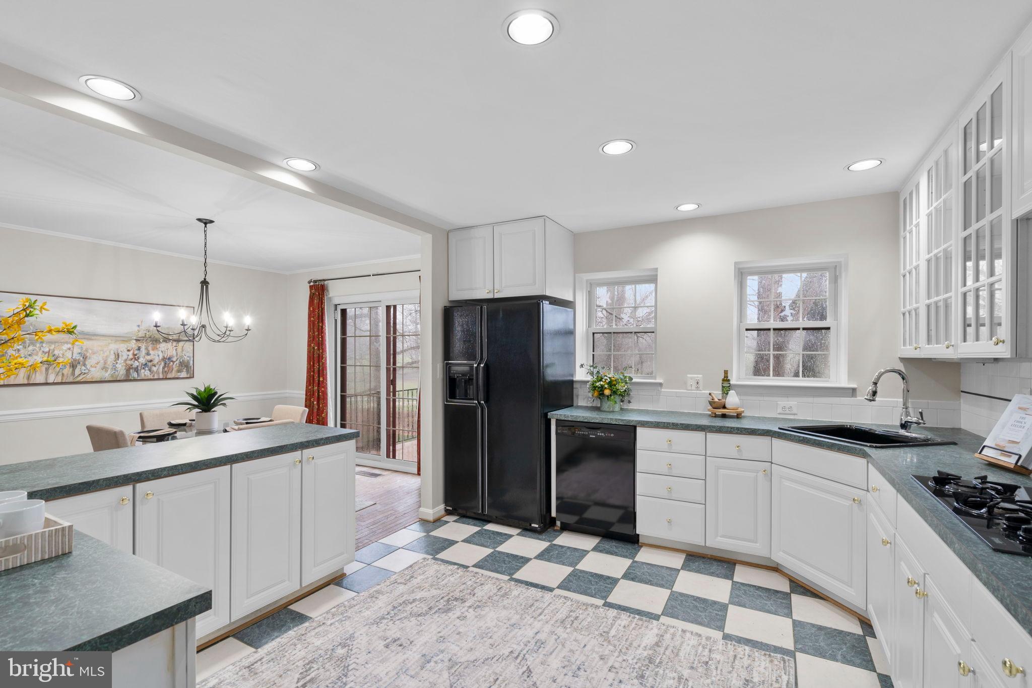 2126 Golf Course Drive Reston, VA 20191 - Photo 17 of 48 a kitchen with stainless steel appliances granite countertop a sink stove and refrigerator