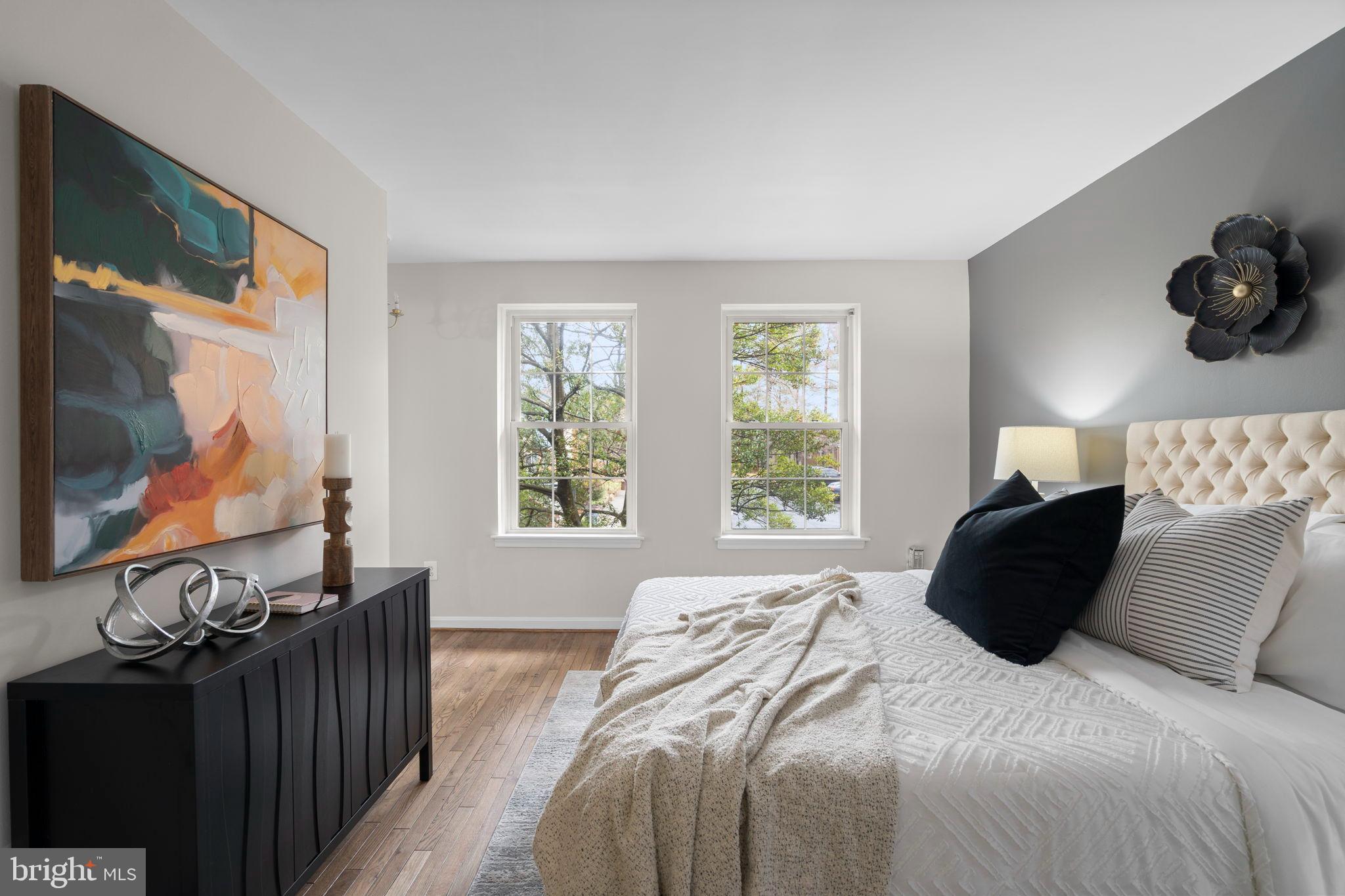 2126 Golf Course Drive Reston, VA 20191 - Photo 20 of 48 a bedroom with a bed mirror and window