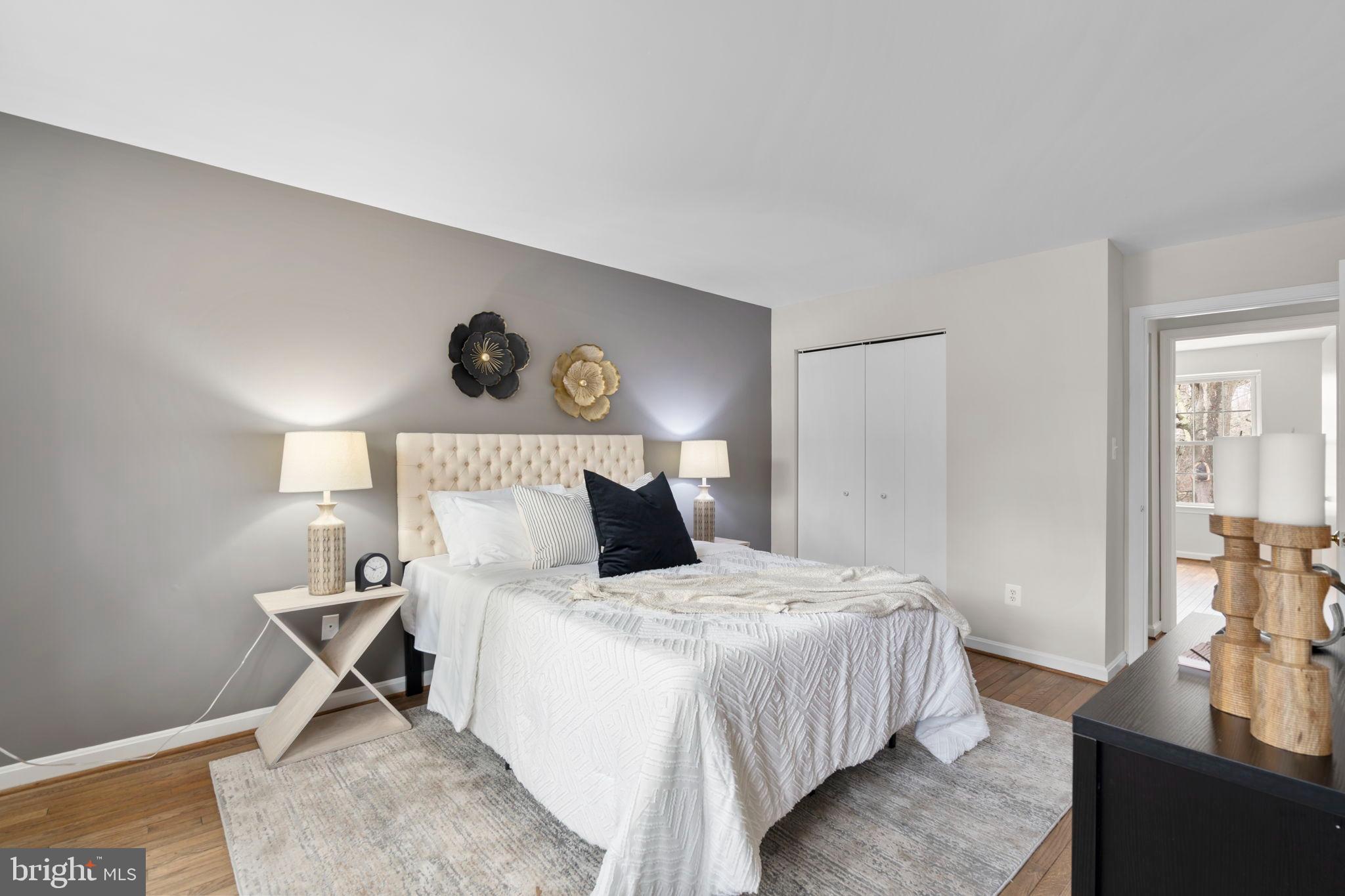 2126 Golf Course Drive Reston, VA 20191 - Photo 22 of 48 a bedroom with a bed and wooden floor