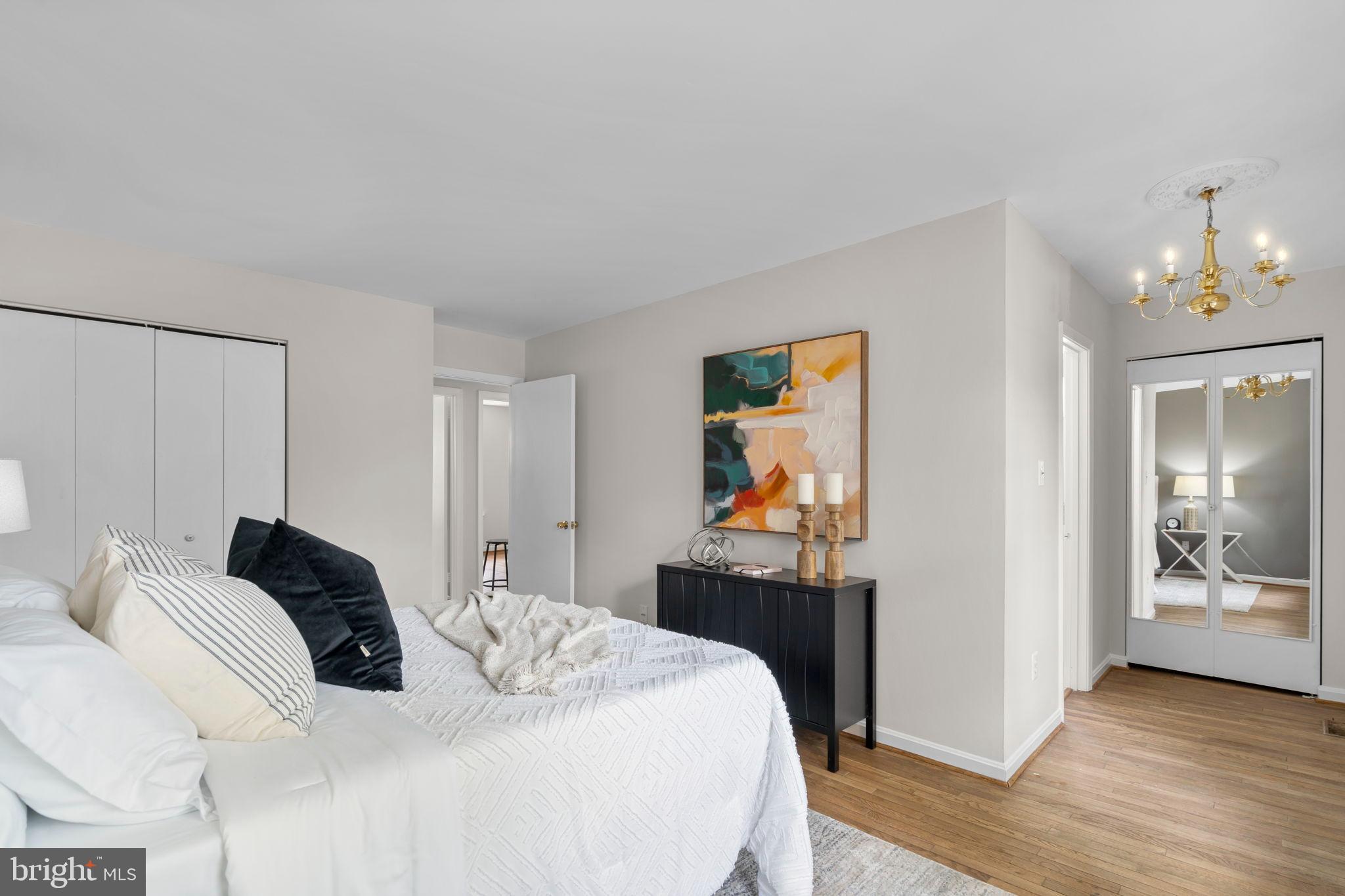 2126 Golf Course Drive Reston, VA 20191 - Photo 23 of 48 a bedroom with a bed and wooden floor