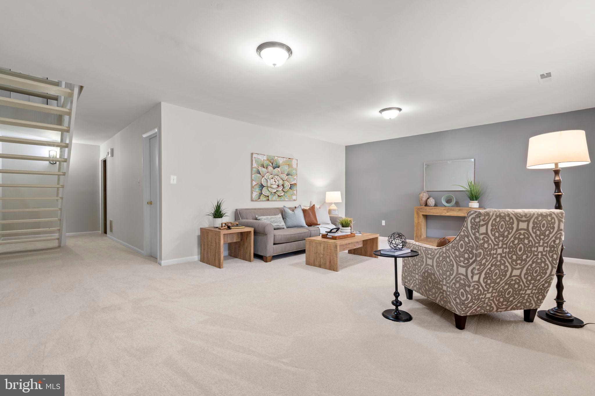 2126 Golf Course Drive Reston, VA 20191 - Photo 35 of 48 a living room with furniture and a lamp