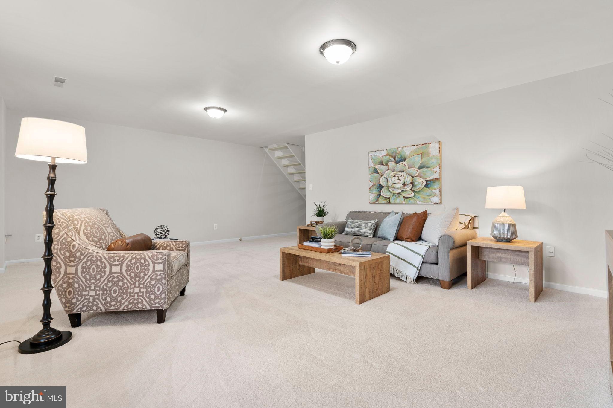 2126 Golf Course Drive Reston, VA 20191 - Photo 36 of 48 a living room with furniture and a lamp