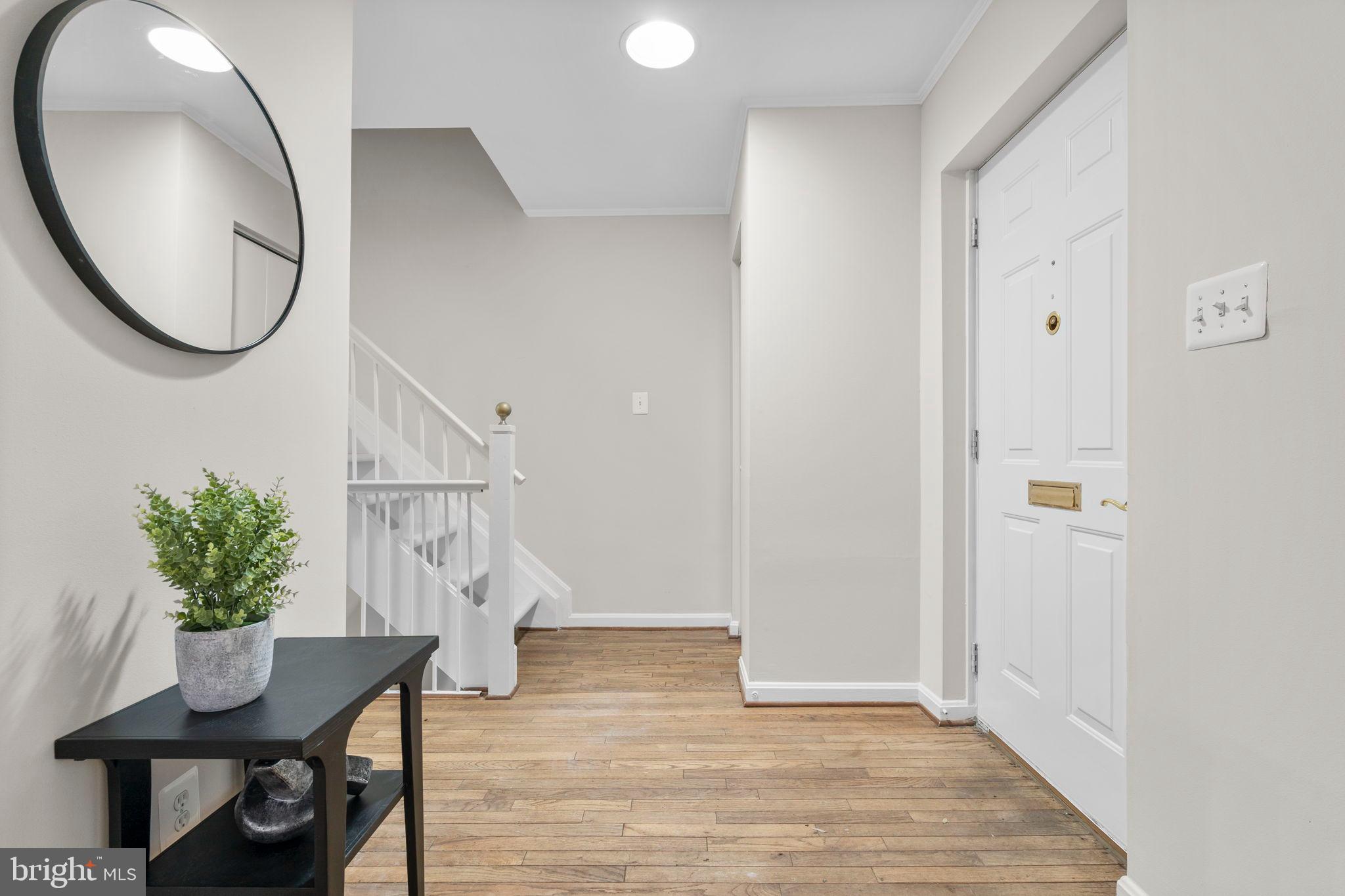 2126 Golf Course Drive Reston, VA 20191 - Photo 5 of 48 a view of a livingroom with furniture and a potted plant
