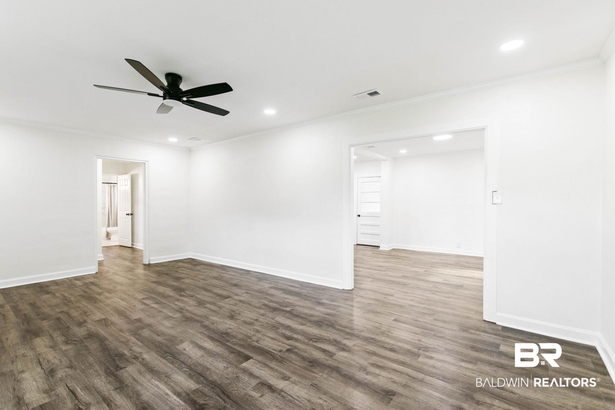 618 Pine Street Saraland, AL 36571 - Photo 12 of 41 Empty room featuring ornamental molding, dark wood-type flooring, recessed lighting, and a ceiling fan
