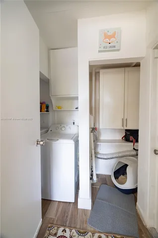 a bedroom with a bed and flat screen tv