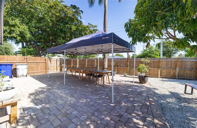 a view of a backyard with sitting area