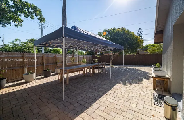 a view of a swimming pool with a patio