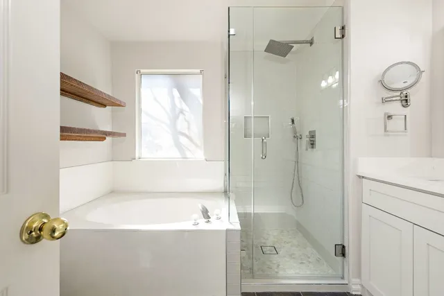a bathroom with a shower and a bathtub