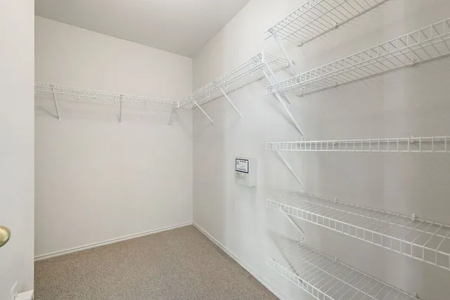 a view of a room with racks on the wall