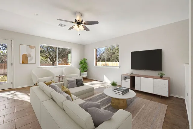 a living room with furniture and a flat screen tv