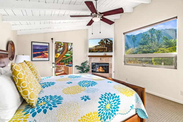 a bedroom with a bed and a chair