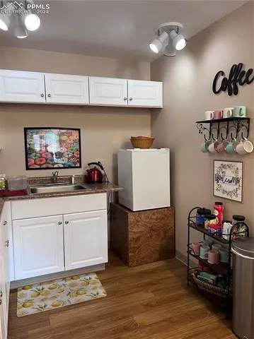 a kitchen with a cabinets and outdoor living room