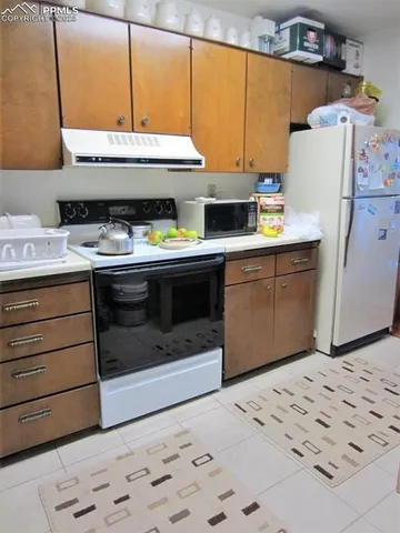 a kitchen with a stove and a microwave