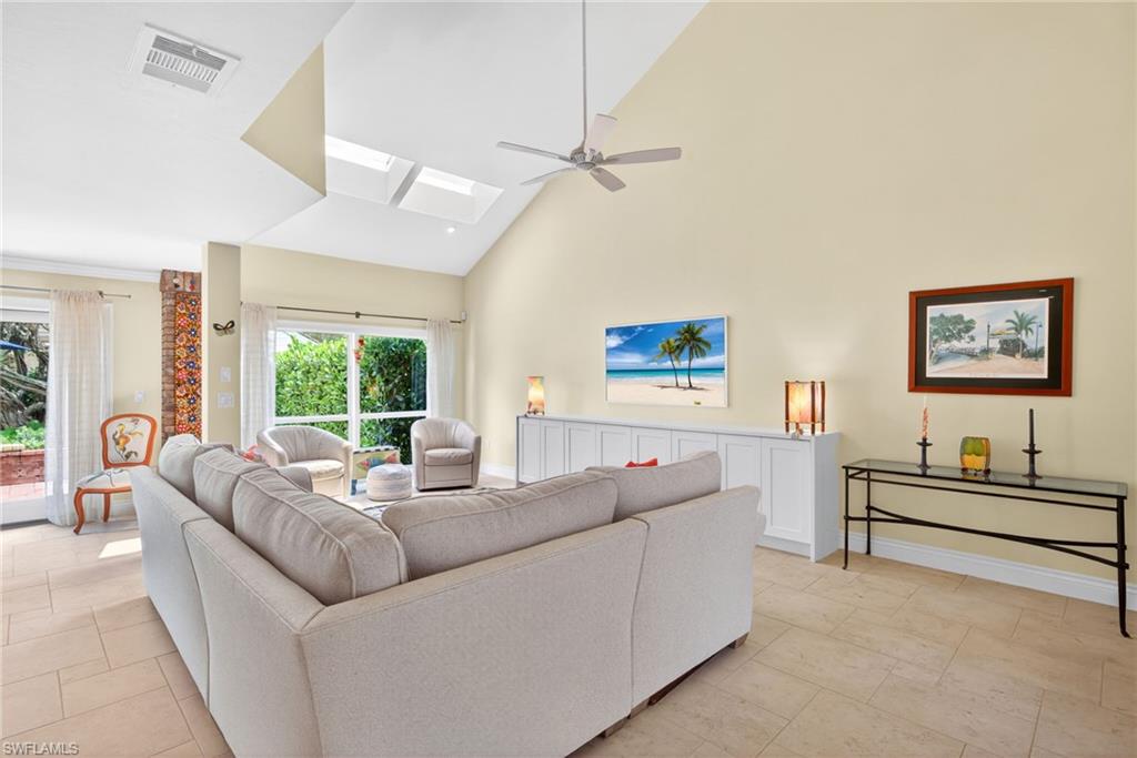 4030 Crayton Road, Unit C2 Naples, FL 34103 - Photo 17 of 32 a living room with furniture and a large window