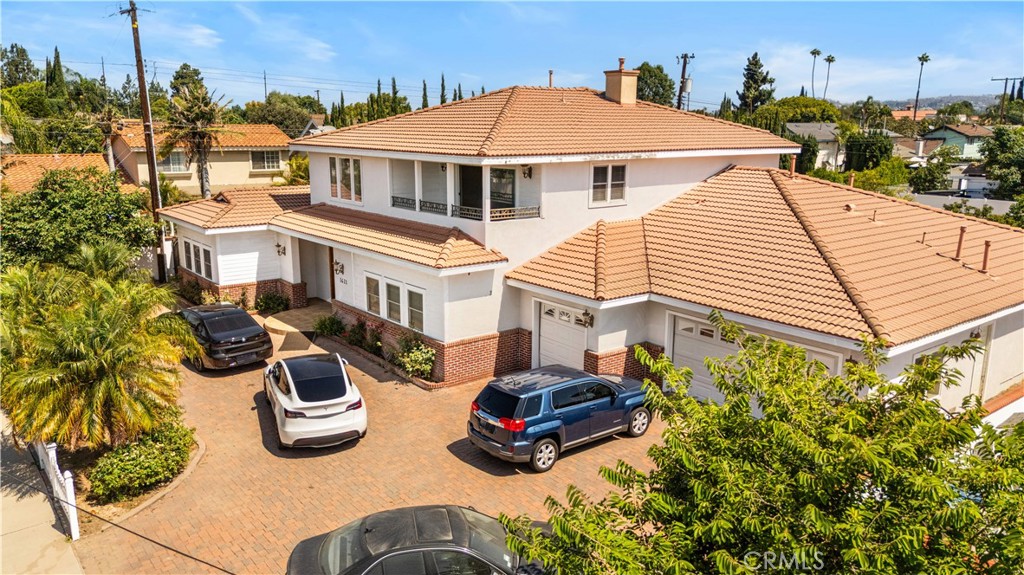 a view of a house with pool and chairs