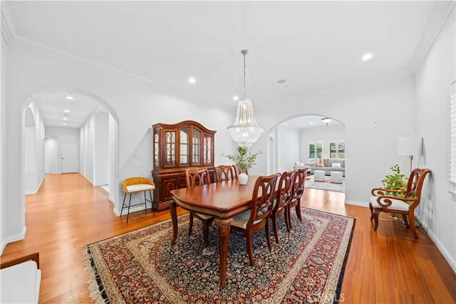a dining room with furniture and wooden floor