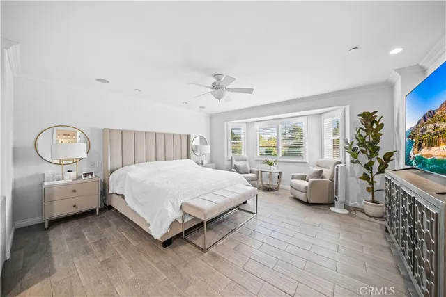 a bed room with a bed and a chair