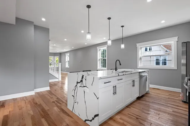 a stove top oven sitting inside of a kitchen