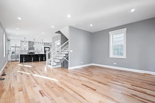 a view of kitchen with furniture and wooden floor