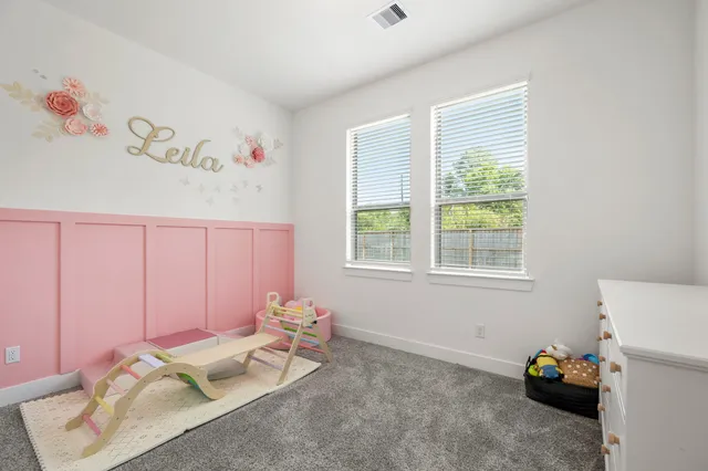 a bed room with a bed and a window