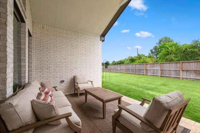 a view of a yard with furniture