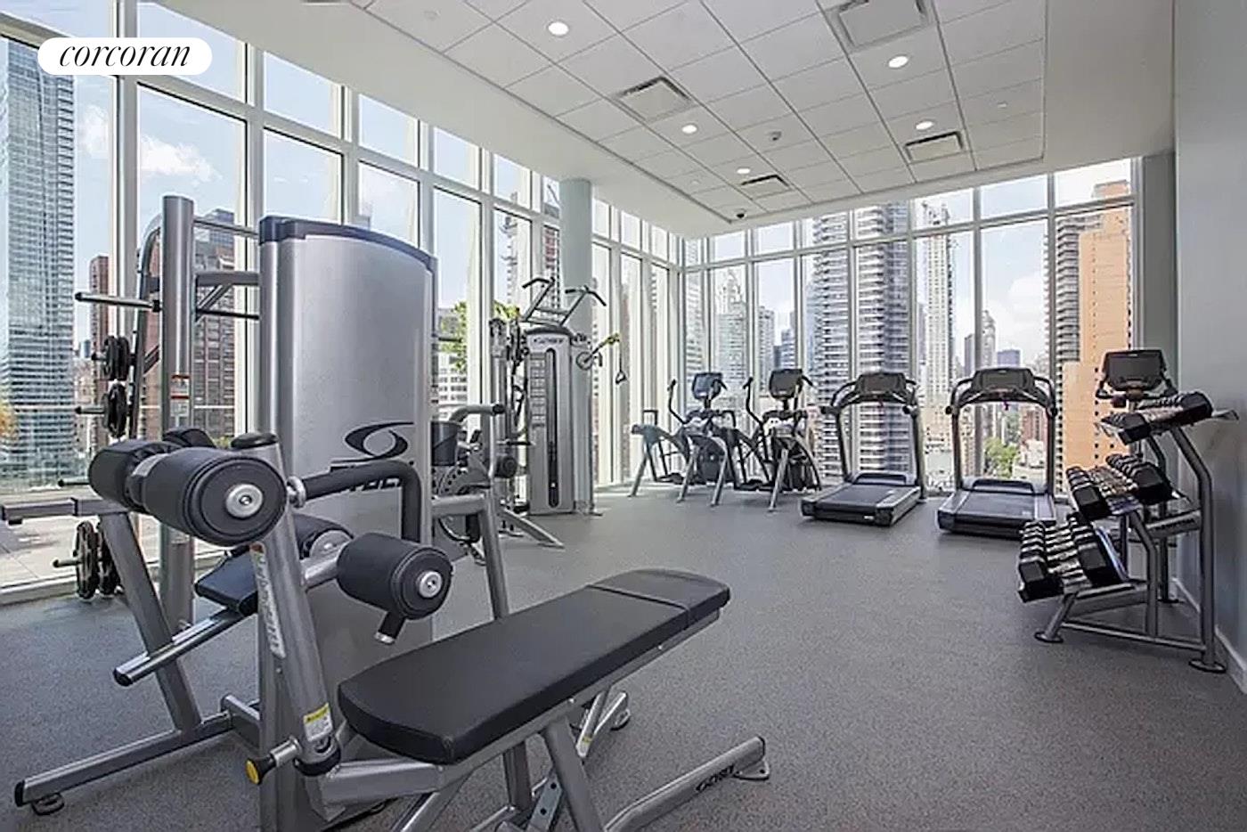 301 East 61st Street, Unit PH Manhattan, NY 10065 - Photo 15 of 16 a view of a room with gym equipment