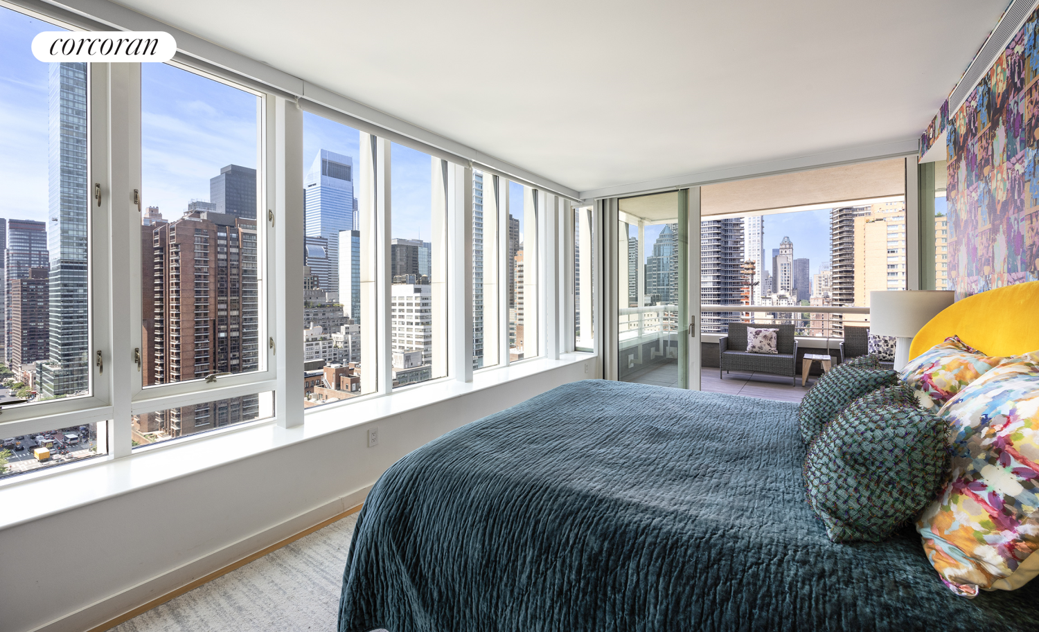 301 East 61st Street, Unit PH Manhattan, NY 10065 - Photo 5 of 16 a bed sitting in a bedroom next to a large window