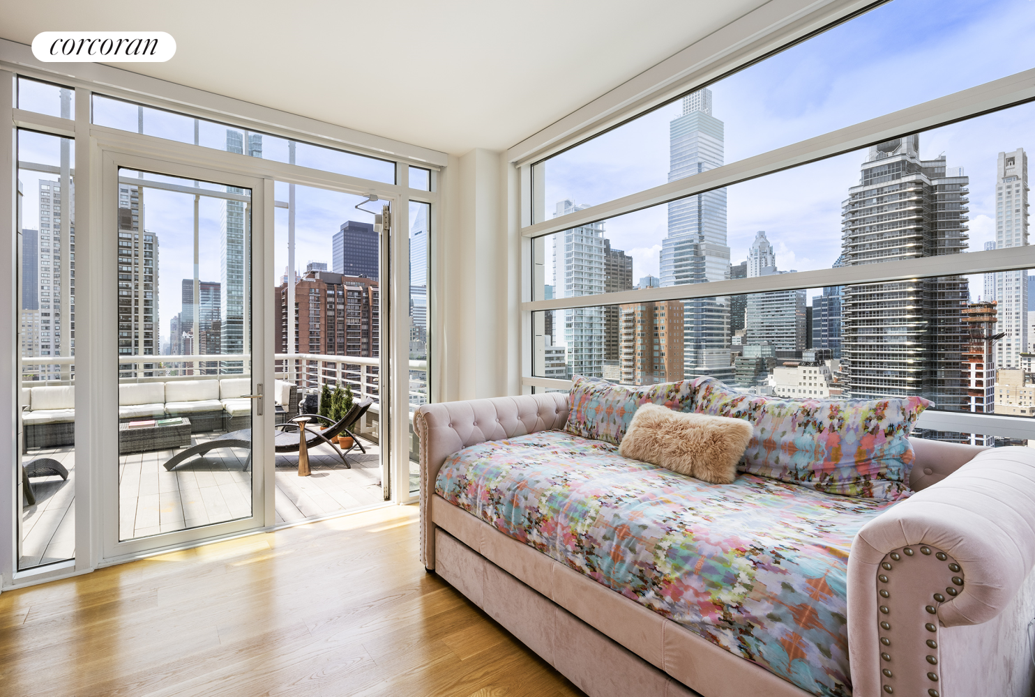 301 East 61st Street, Unit PH Manhattan, NY 10065 - Photo 8 of 16 a bedroom with furniture and large windows