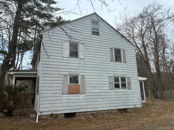 a view of a house with a yard and garage