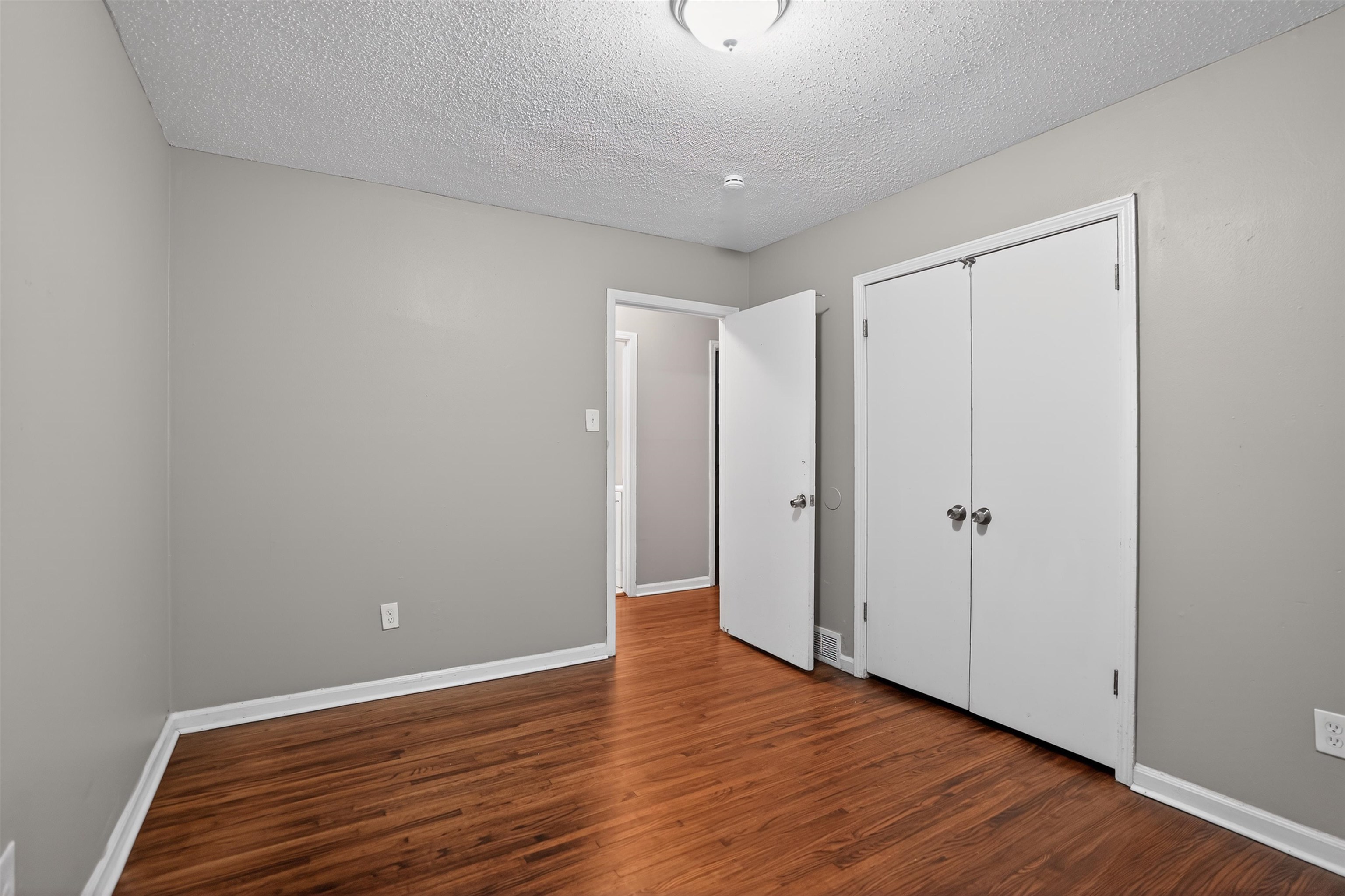 4191 Yale Road Memphis, TN 38128 - Photo 18 of 22 Interior room featuring wood-finish flooring and light gray walls