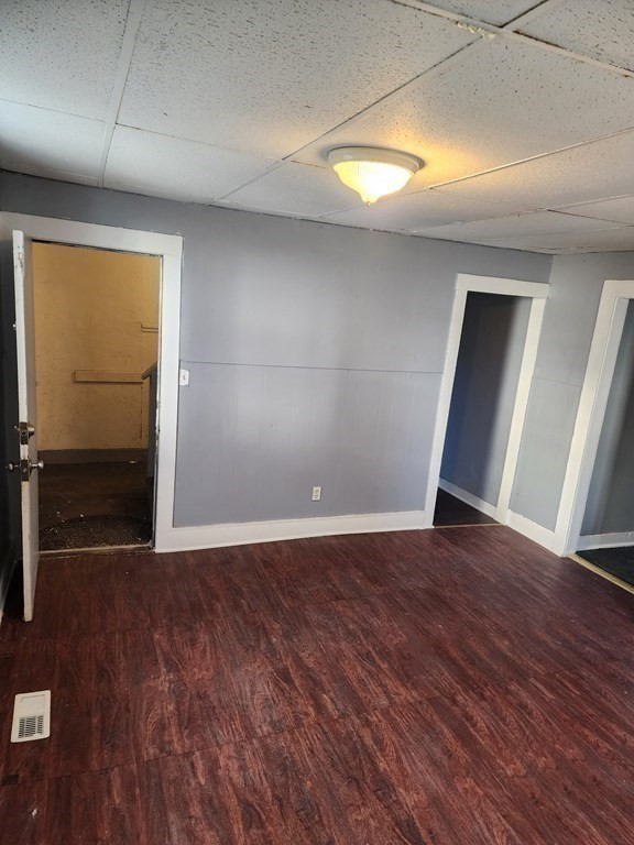 26 Hawley Street Worcester, MA 01609 - Photo 3 of 36 an empty room with wooden floor and windows