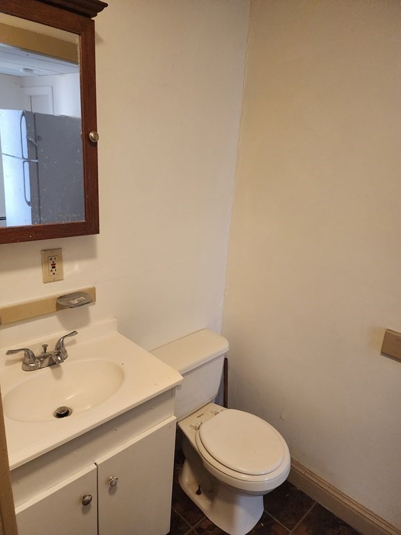 26 Hawley Street Worcester, MA 01609 - Photo 8 of 36 a bathroom with a sink mirror and toilet