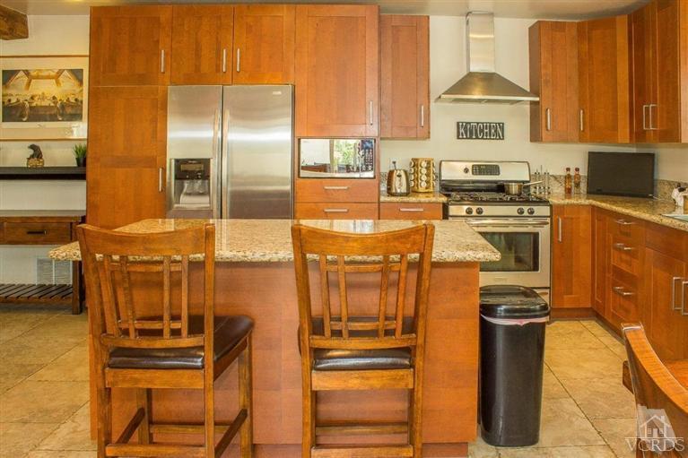 6360 Keystone Street Simi Valley, CA 93063 - Photo 2 of 17 a kitchen with cabinets and appliances