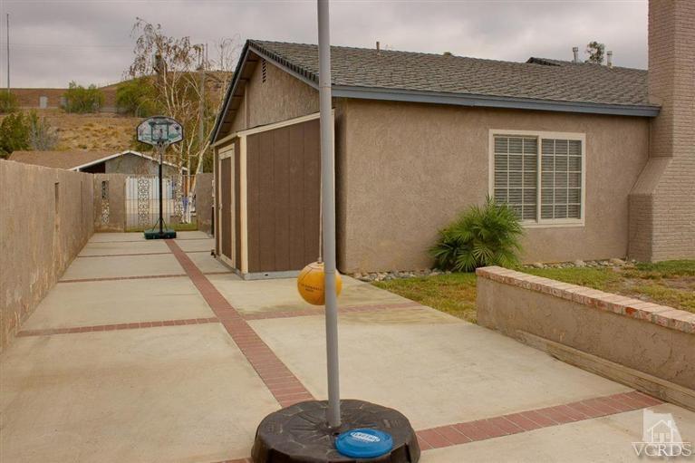 6360 Keystone Street Simi Valley, CA 93063 - Photo 16 of 17 a front view of a house with a yard