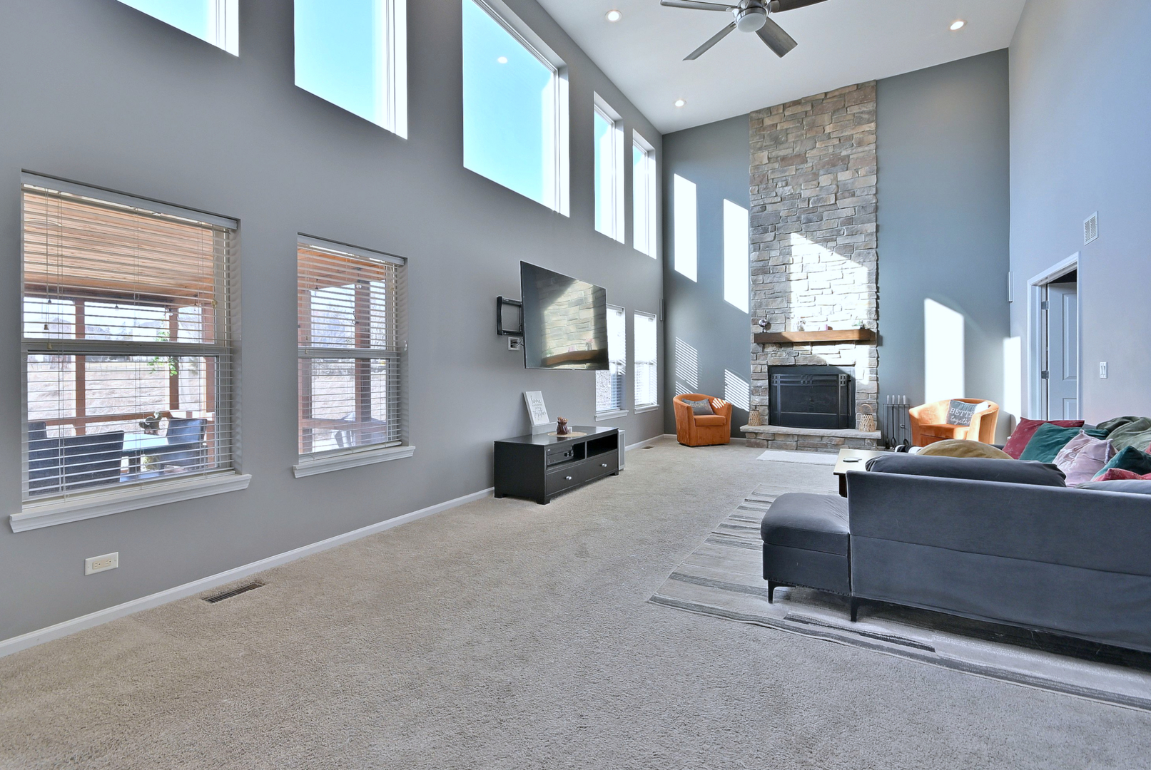 579 Homestead Court Aurora, IL 60506 - Photo 21 of 45 a living room with furniture and a large window