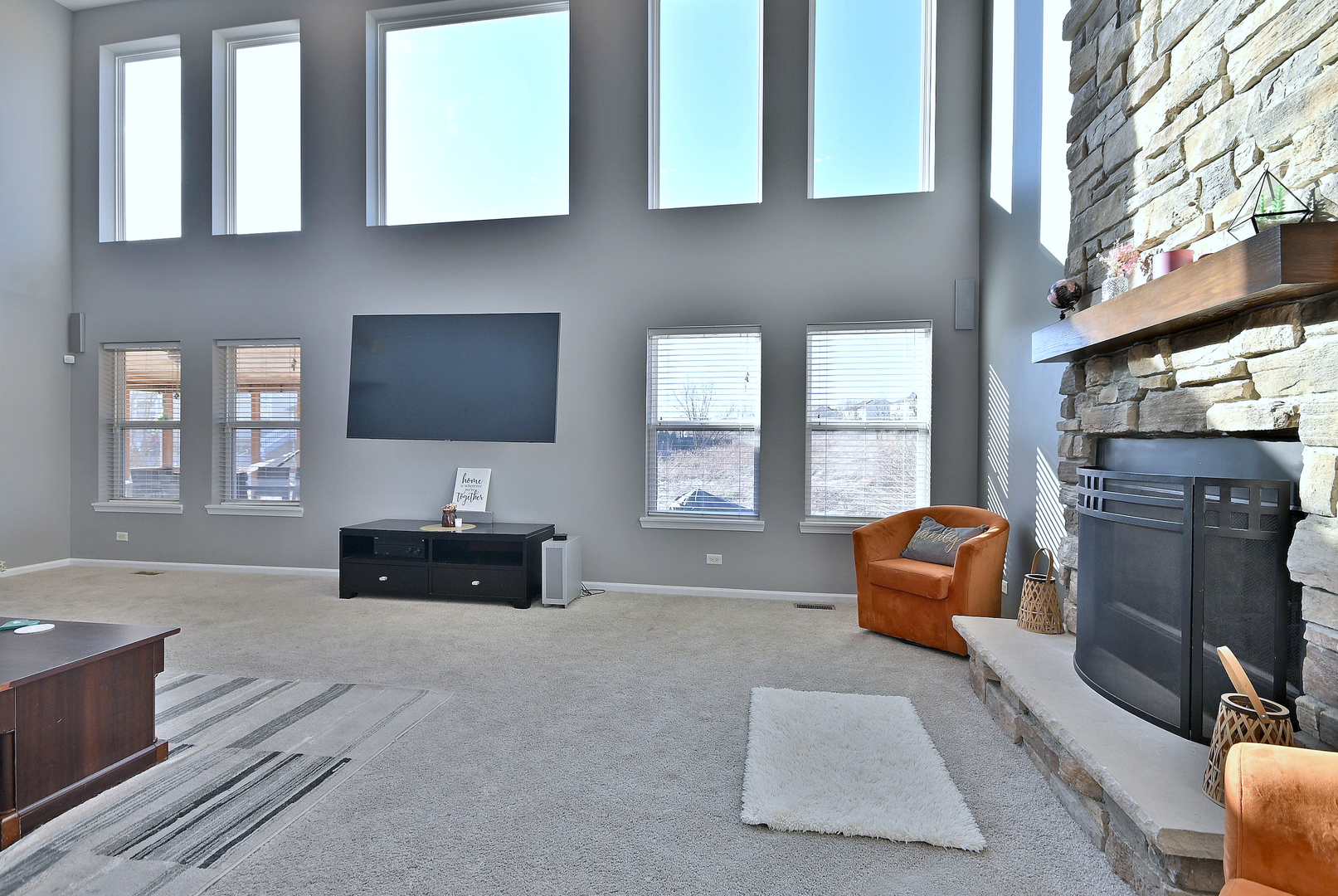 579 Homestead Court Aurora, IL 60506 - Photo 22 of 45 a living room with furniture a flat screen tv and windows