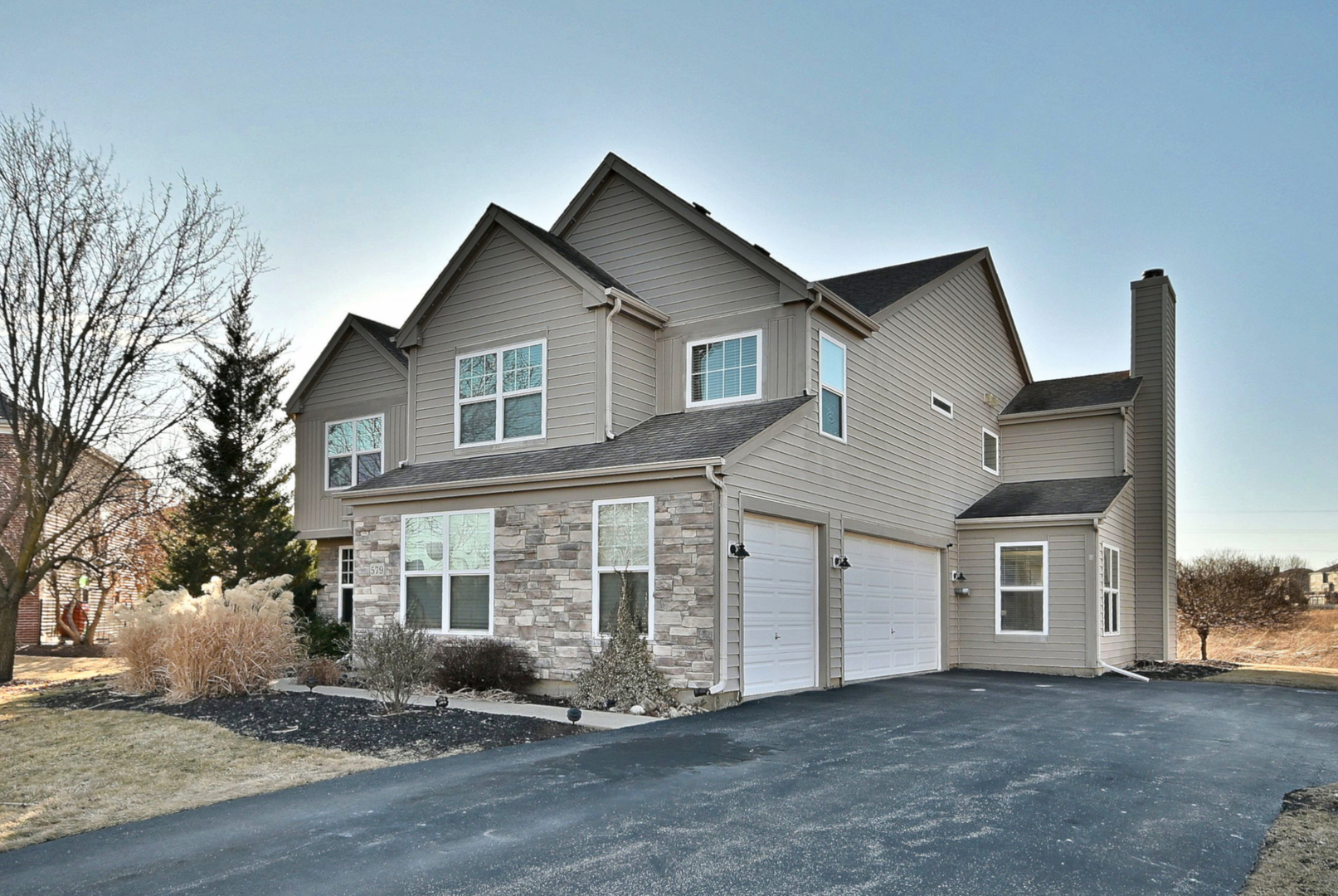 579 Homestead Court Aurora, IL 60506 - Photo 3 of 45 a front view of a house with a yard