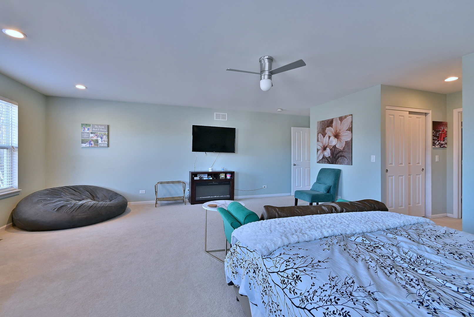 579 Homestead Court Aurora, IL 60506 - Photo 36 of 45 a bedroom with a bed and a flat screen tv