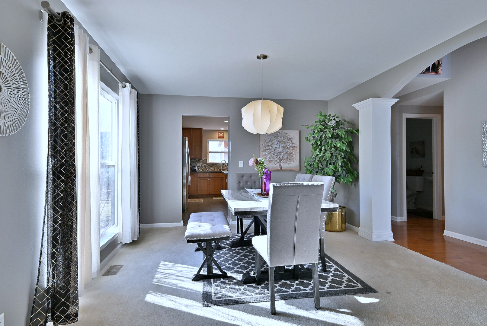 579 Homestead Court Aurora, IL 60506 - Photo 9 of 45 a view of a dining room with furniture window and wooden floor