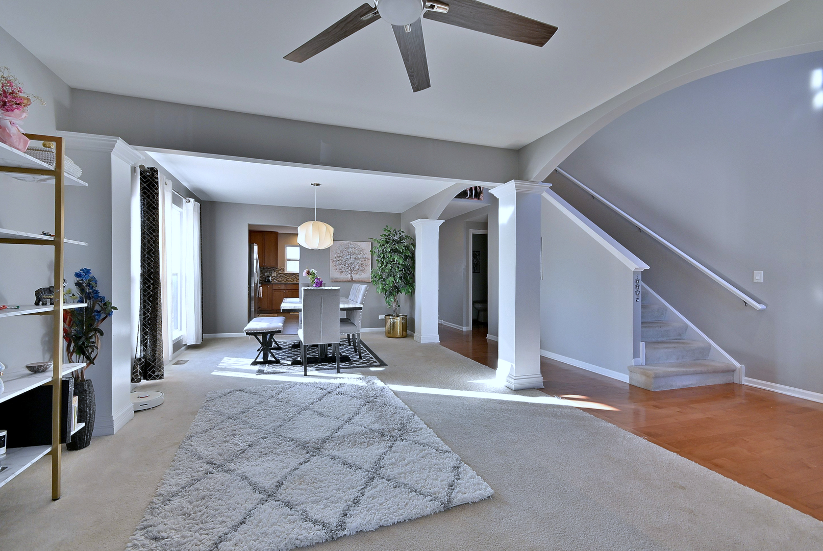 579 Homestead Court Aurora, IL 60506 - Photo 10 of 45 a living room with furniture and a chandelier
