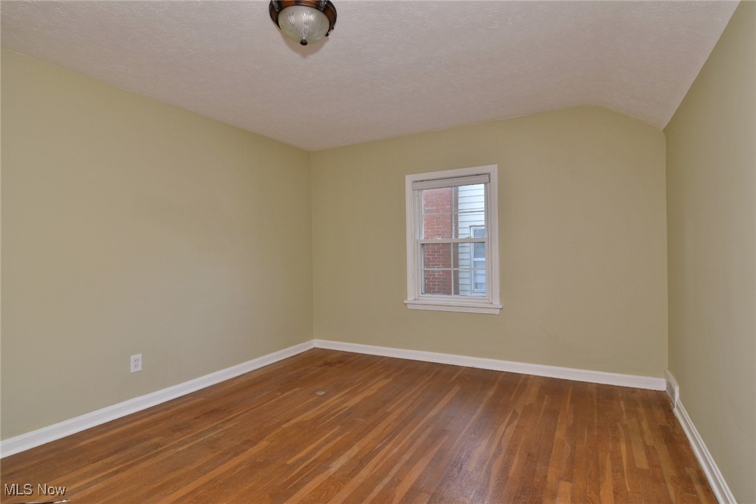 3679 Fenley Road Cleveland Heights, OH 44121 - Photo 26 of 45 Spare room with wood finished floors and a textured ceiling