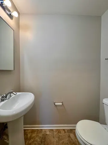 a bathroom with a sink a toilet