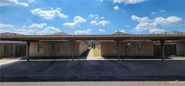 a view of a house with a backyard