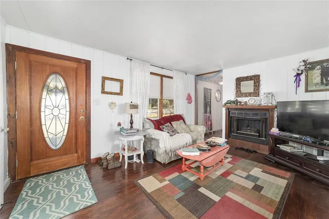 a living room with furniture and a window