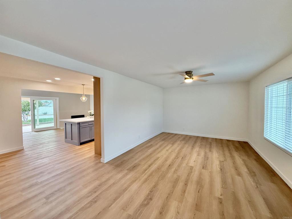 10296 Baroness Avenue San Diego, CA 92126 - Photo 18 of 27 a view of a kitchen with wooden floor and a sink
